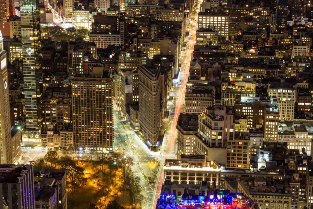 Night aerial view of the Flatiron building in the Flatiron district.